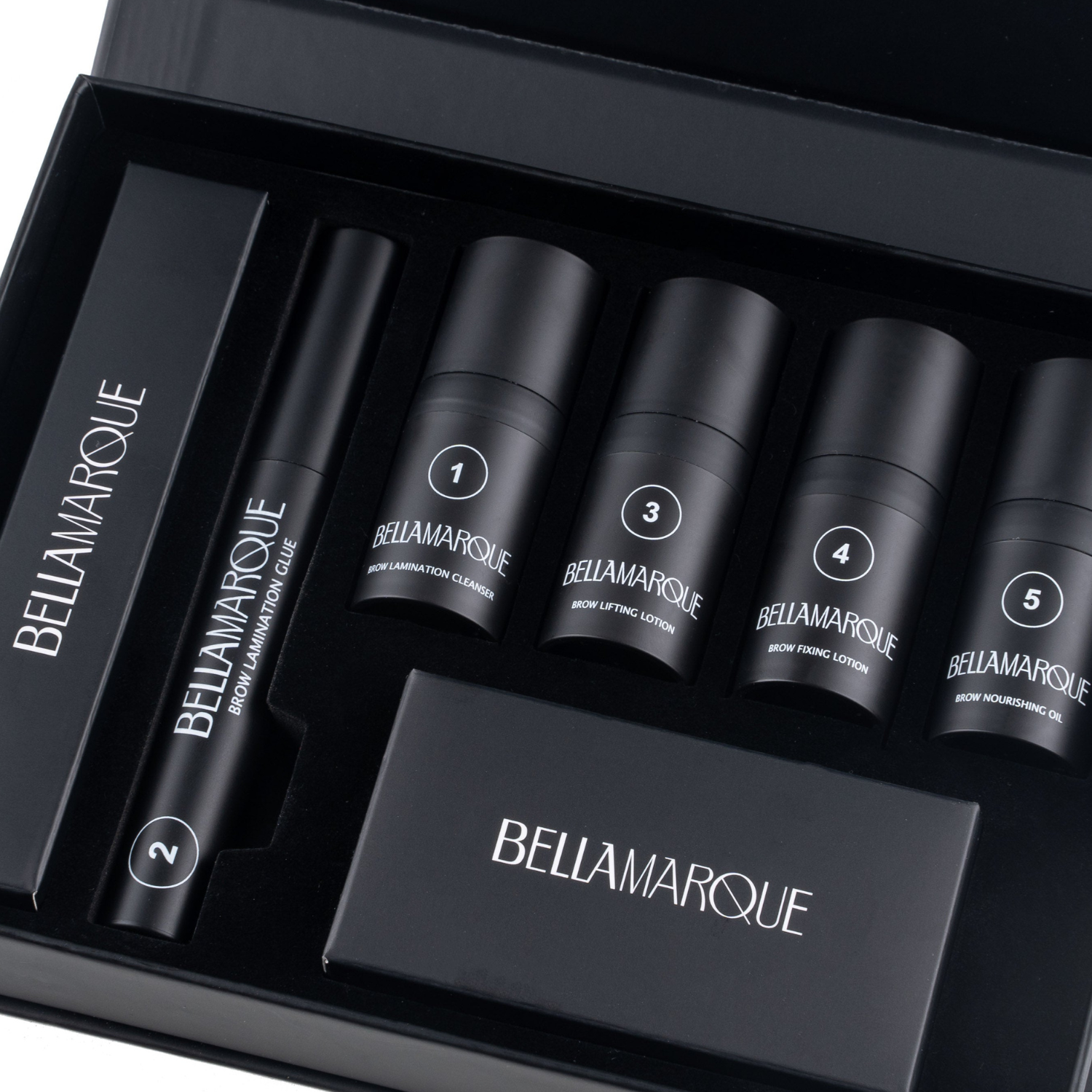 Black kit box open showing various Bellamarque brow products