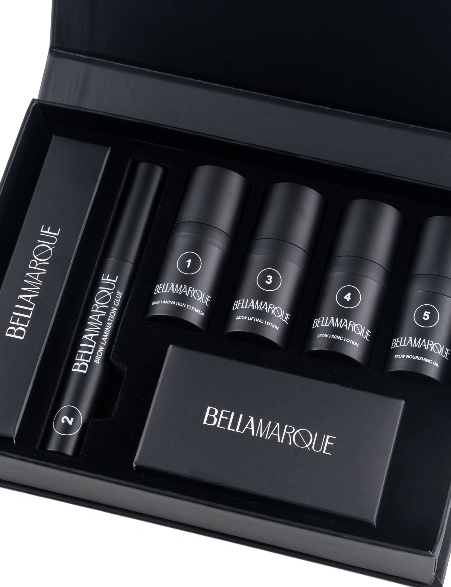 Black kit box open showing various Bellamarque brow products