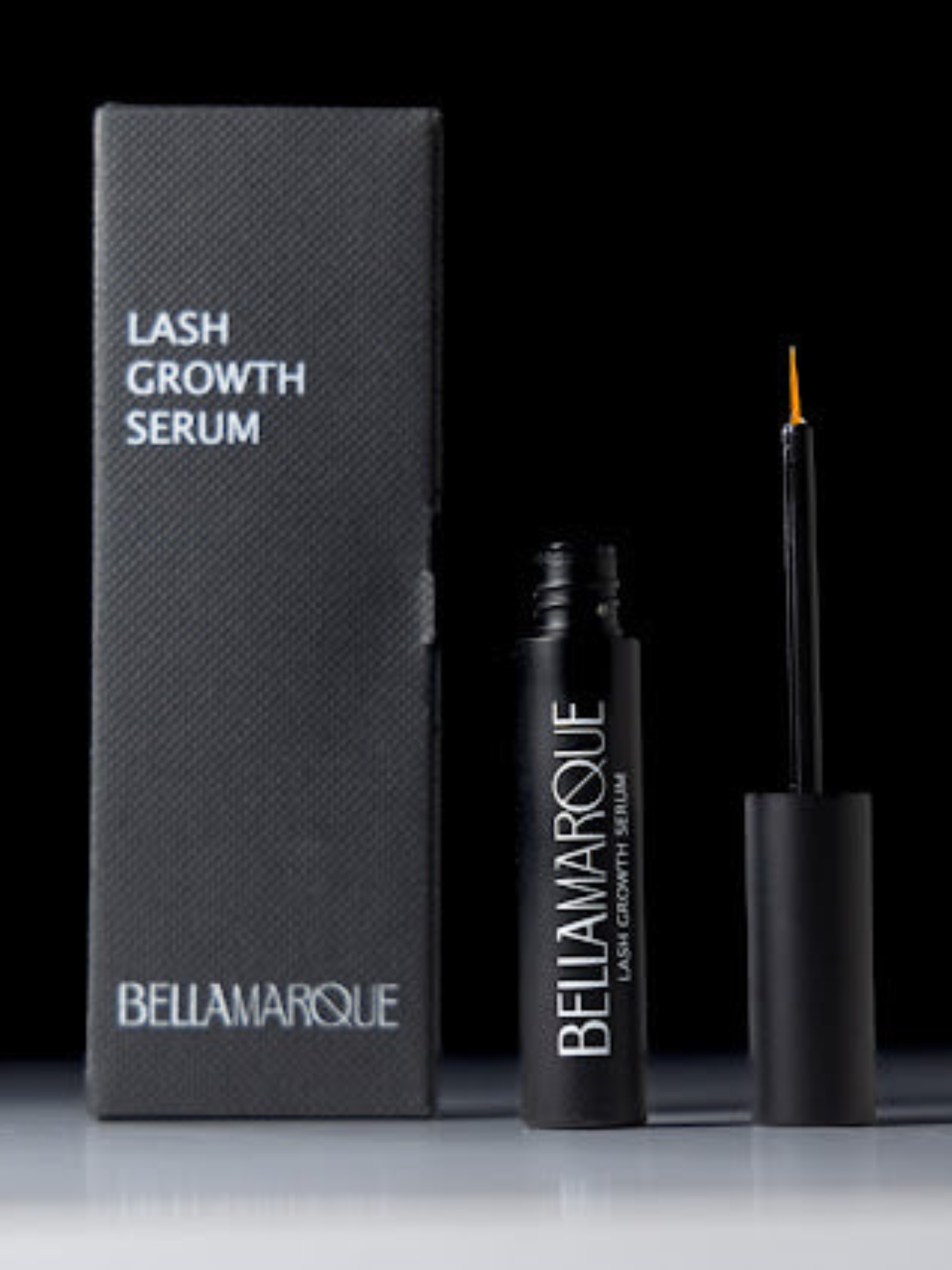 Open BellaMarque Lash Growth Serum with orange applicator on a dark background.